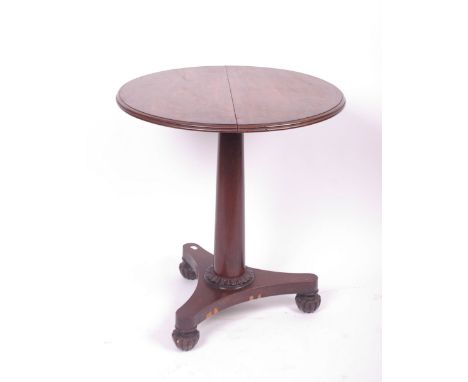 A 19th Century mahogany circular occasional table, column support on tripod base and carved feet. 68cm diameter. 