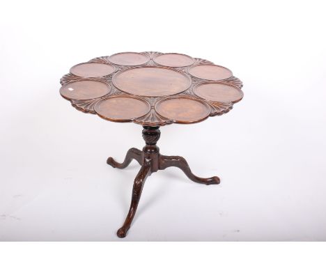 A George III mahogany 'dish top' circular tilt top tripod table. Top diameter 89cm