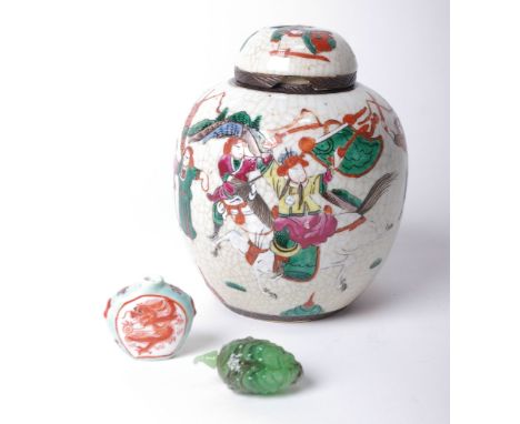A Chinese ginger jar together with a faux jade carving of a fish.
