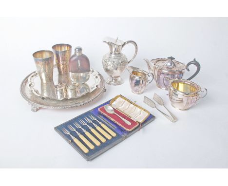 A mixed lot of silver plate to include platters, jugs, teapot, flatware, a copper kettle and set of brass fire irons 