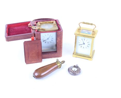 A 20th Century brass cased carriage clock, the four sectional glass case with swing handle, visible movement, with a Roman nu