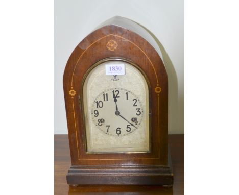 Mahogany arch topped mantel clock, the silvered dial with twin train movement, Arabic numerals and Chime/Silent, striking on 