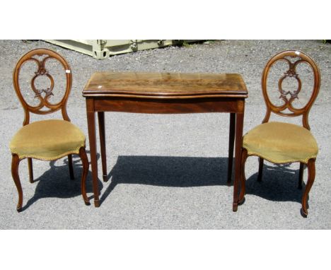 19th century mahogany serpentine fronted card table and a pair of balloon back dining chairs