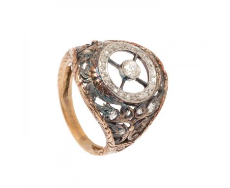 1920s bombé ring in yellow gold with silver overlays. Diamonds, old brilliant-cut, in the centre, weighing ca. 0.20 cts, set 