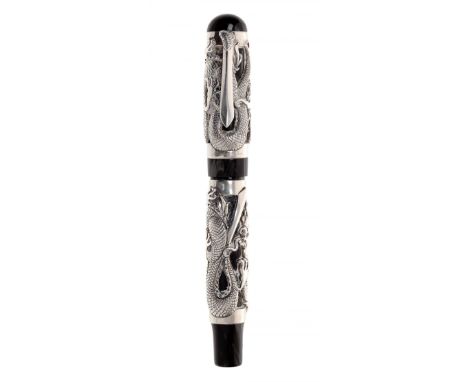 MONTEGRAPPA THE DRAGON FOUNTAIN PEN.Black resin barrel with the shape of a dragon in 975 sterling silver, two red rubies.Limi