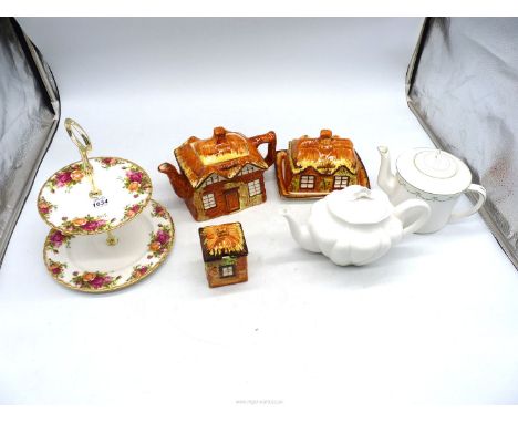 A Shelley china teapot, a Foley china teapot, a Royal Albert "Old Country Rose" cake stand, a Cottage ware Price Kensington t