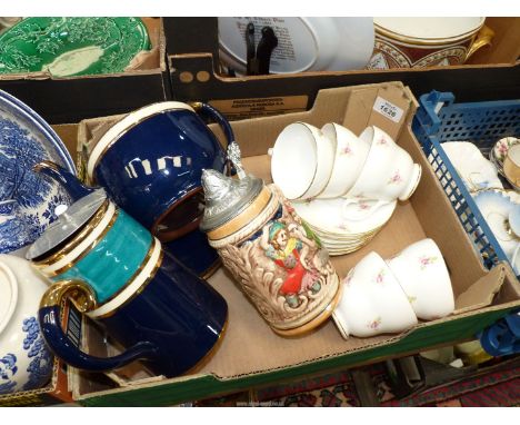 A small quantity of china including a teapot and stand with hot water jug, stein mug and floral part teaset.