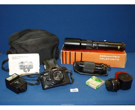 A quantity of camera equipment to include: Fugi STX2 SLR camera, a Hanimex HMC lens, a Vivitar flash, a Vivitar teleconverter
