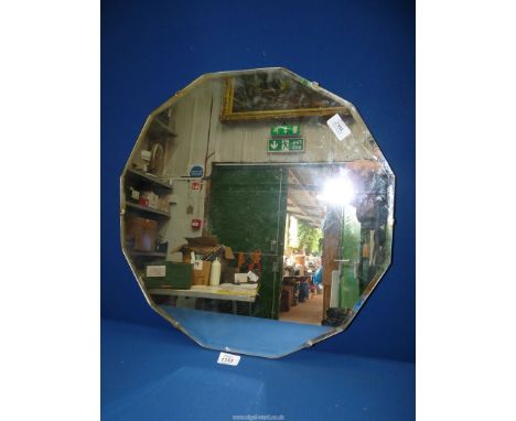 A twelve sided bevel edged Mirror, 20" x 20".