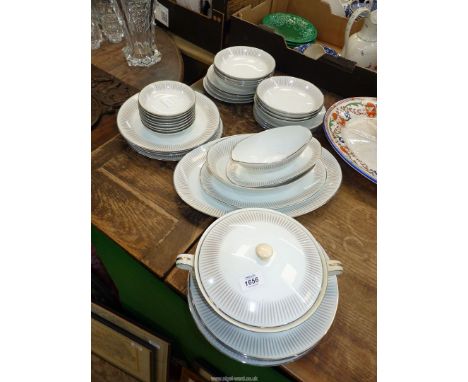 A Noritake "Biarritz" dinner service having a decorative silver rim and a leaf design, dinner plates, side plates, dishes, bo