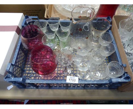 A quantity of glasses to include: cranberry coloured brandy balloons, dessert wine and port, plus rose decorated lemonade jug