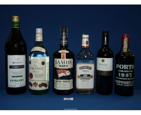 A quantity of bottles of alcohol to include: Lamb's Navy Rum 1.14 litre, Bacardi superior 1.14 litre Rum, Jose Cuervo Tequila