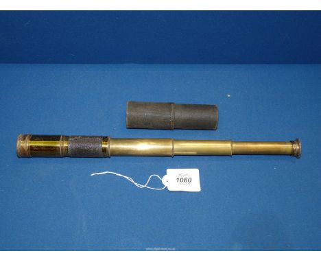 A Negretti and Zambra brass and leather four draw Telescope with original covers for both lenses, compact 5" long extending t