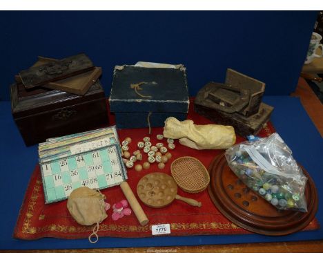 A vintage red leather desk skiver with gilt tooling, a solitaire board with marbles, Georgian tea caddy with secret drawer fo