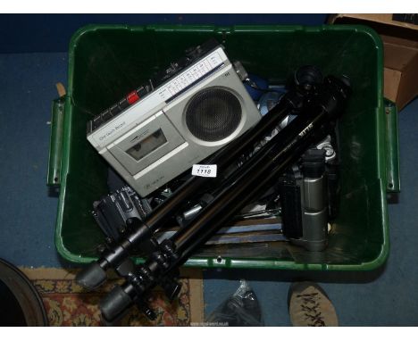 A green tub of cameras etc. to include: Canon EOS 500N SLR, Samsung VP-A22 cine camera, Slik tripod, etc.