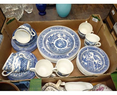 A quantity of blue and white china including twelve cups, mixed saucers by Broadhurst, Churchill,Old Castle Barrett's and old