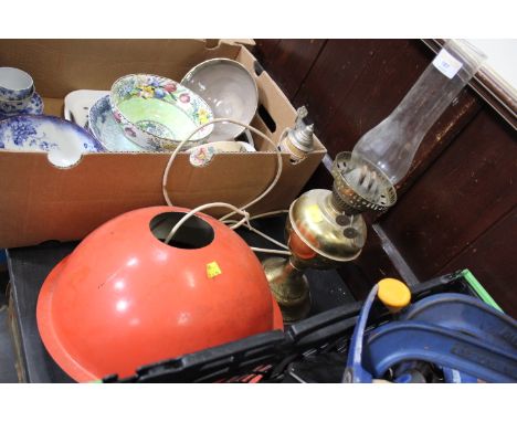 Vintage oil lamp and orange ceiling light fitting