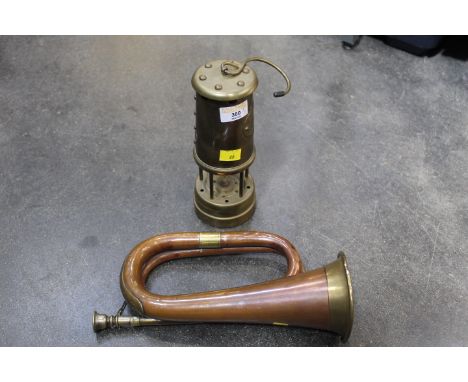 Brass and copper bugle and miner's lamp 