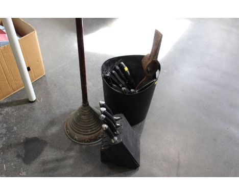 A poss stick, knife block, a quantity of loose knifes etc 