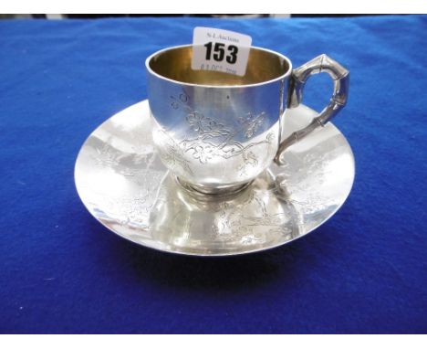 A LATE 19TH CENTURY CHINESE EXPORT SILVER CUP AND SAUCER ENGRAVED WITH BIRDS AND FLOWERS, WITH SIMULATED BAMBOO HANDLE, MARKS