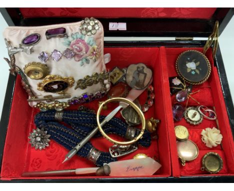 A musical box filled with costume jewellery as well as, brooches, mother of Pearl French pens and other interesting items.