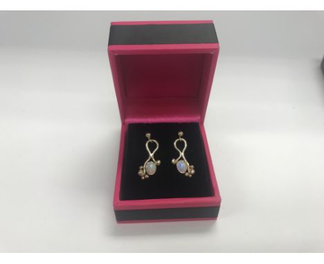 A pair of 9ct gold Opal earrings. Approx 2.11 grams.
