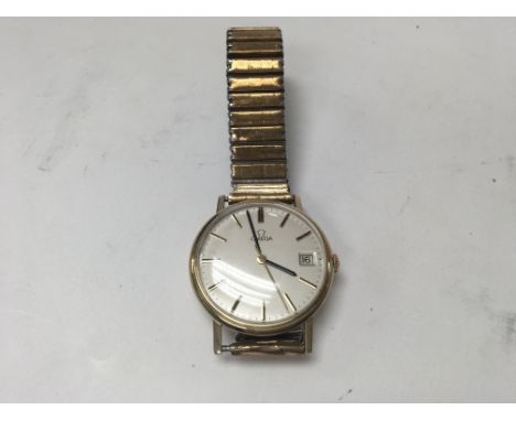 A 9ct gold manual omega date just, seen working.