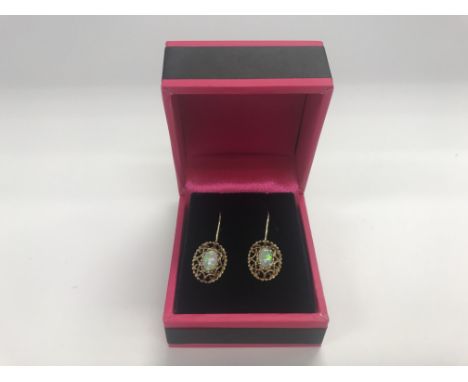 A pair of 9ct gold Opal earrings, approx 1.80 grams.