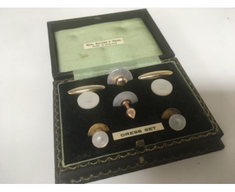 A well presented cased set of mother o pearl dress studs.