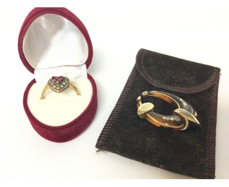 A 9ct gold heart ring set with Rubies and diamonds 2.2g size O and an Art Deco tigers eye pendant. Postage category A