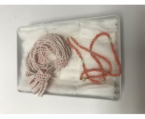 Angel coral bracelet and a coral and Pearl necklace with a 14k gold clasp.