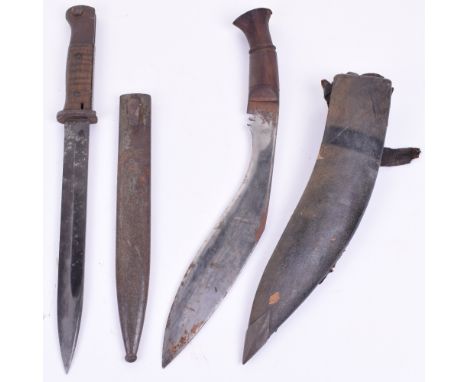 Gurkha Kukri, with wooden grip and steel plate. Curved single edged blade measuring 28 ¼ cm. Some surface rusting to the blad