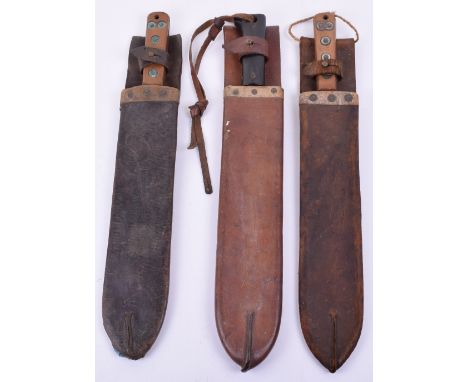 Great War 1917 Dated Machete, housed in its original leather scabbard with large belt loop. Blade with makers mark and clear 