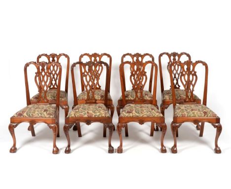A Set of Eight Reproduction Chippendale Style Dining Chairs, of recent date, with decorative splats and beige foliate decorat