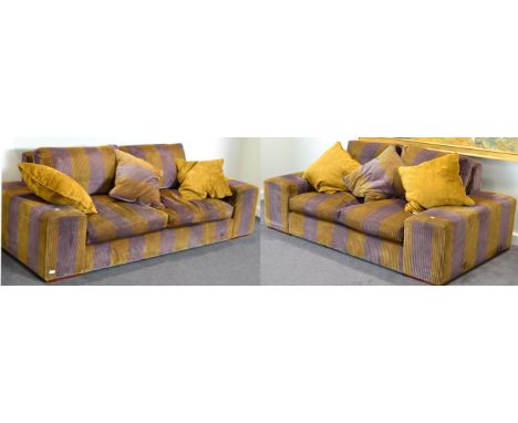 A Pair of Good Quality Sofas, upholstered in purple and mustard striped velvet, comprising a three-seater sofa with four squa