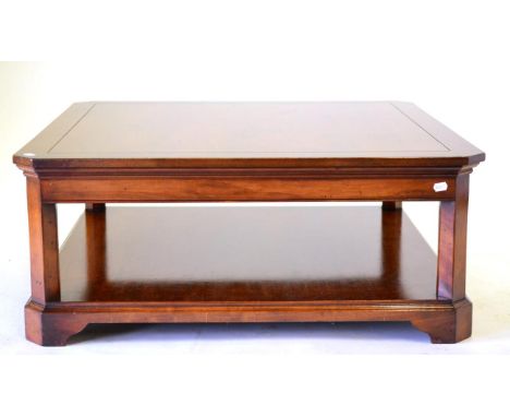 An R E H Kennedy Mahogany Coffee Table Model 4051, of recent date, of square form with canted corners, fitted with a shelf, r