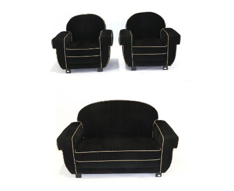 An Art Deco Three Piece Lounge Suite, upholstered in black chevron velvet with leather piping, comprising a two-seater sofa w