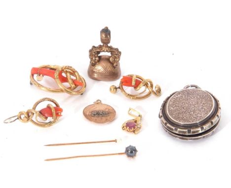 Mixed Lot: Victorian fob with a bloodstone monogrammed matrix, two stick pins, yellow metal disc pendant centring a bear, a m