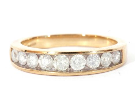 Modern 9ct gold and diamond half hoop ring featuring nine graduated round brilliant cut diamonds, channel set, size R