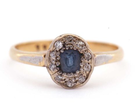 Sapphire and diamond cluster ring, the cushion shaped sapphire surrounded by ten small old cut diamonds, stamped 18ct, size L