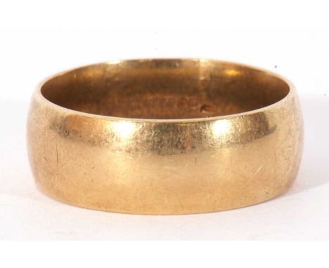 18ct gold wedding ring, the wide band of plain polished design, 10.7gms, size U/V