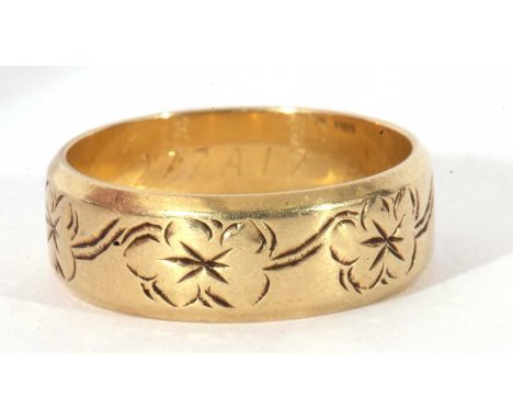 14ct gold stamped wedding ring, the band with a floral engraved design, 6.7gms, size R/S