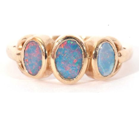 Modern 9ct gold and opalescent three stone ring featuring three graduated bezel set flat cut opalescents, size N (a/f)