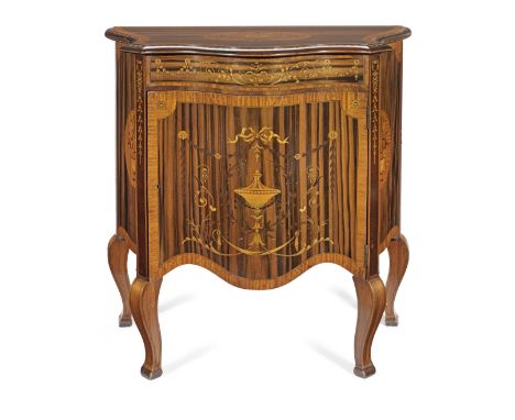 A late Victorian zebrawood, satinwood, purplewood and marquetry serpentine commodeCirca 1900inlaid with Neoclassical urns, a 