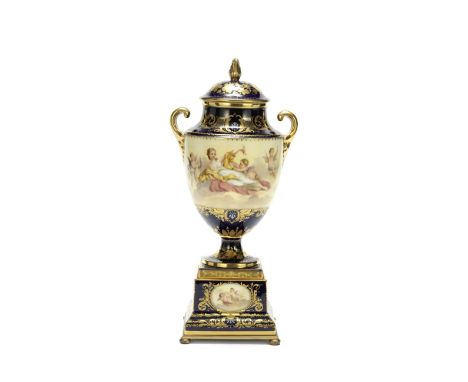 An early 20th century Continental Sèvres-style porcelain garniture vase and coverof ovoid shouldered urn form with short scro