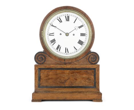 A late 19th century figured oak and ebonised banded drum table clock with repeatthe movement signed and numbered Arnold, 84 S