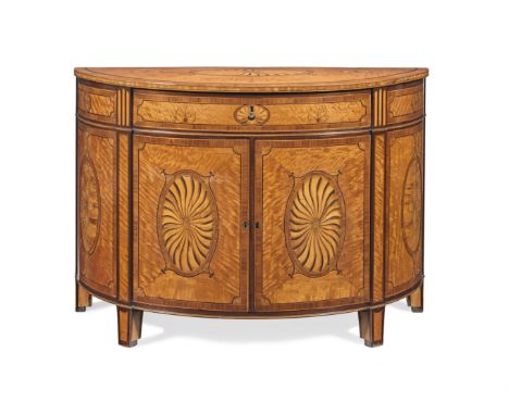 An Irish George III satinwood, sycamore, kingwood, tulipwood, purplewood and marquetry demi-lune commodein the manner of Will