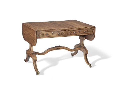 A Regency mahogany and ebony inlaid sofa tableCirca 1810, inlaid with stylised foliage, stars and scrolls, with two short fri