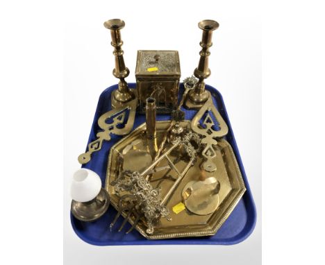 A pair of brass candlesticks, folding easel stand, octagonal tray, tea caddy, trivets etc.