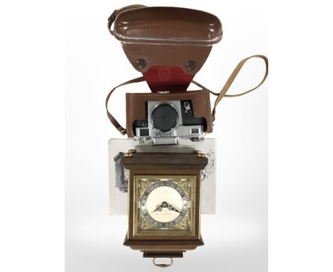 A reproduction miniature bracket timepiece by Garrard and Co., retailed by Elliott of London, height 22cm, together with a vi